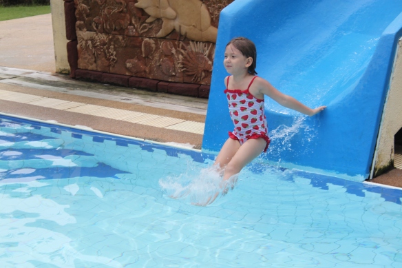 Flo on her 100th trip down the hotel pool's waterslide